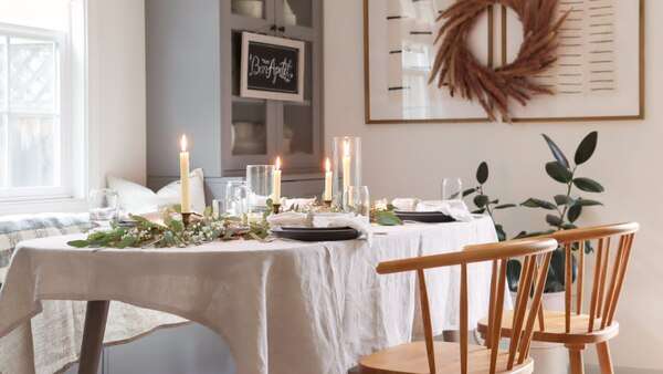 Warm table setting with a cup and peaceful indoor details in soft natural light
